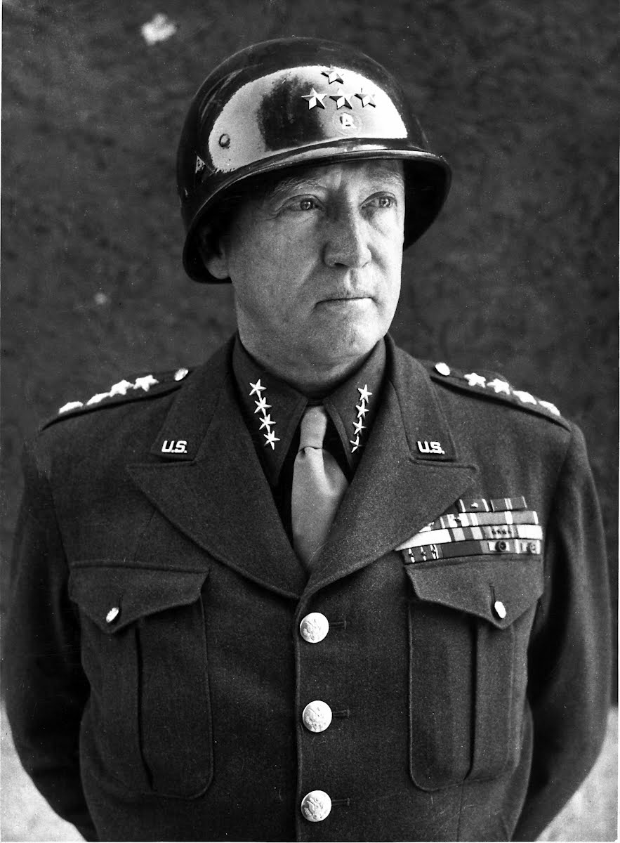 Headshot of GEN Patton, against a neutral background.
